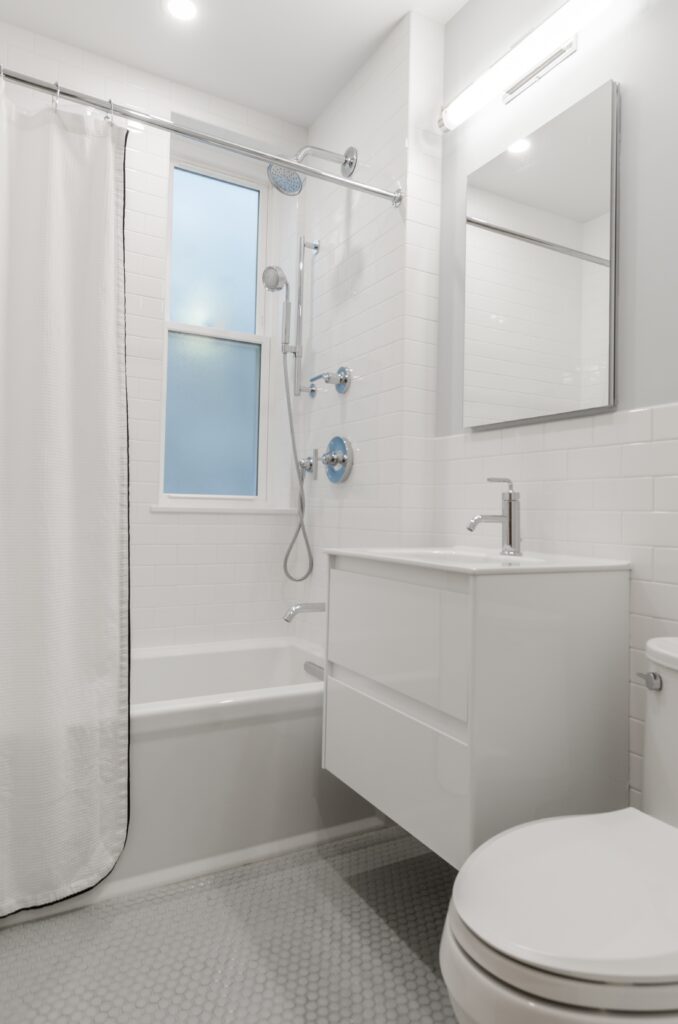photo of standard bathroom (tub, sink and toilet). All fixtures and systems can be serviced by our Phoenix plumbers.